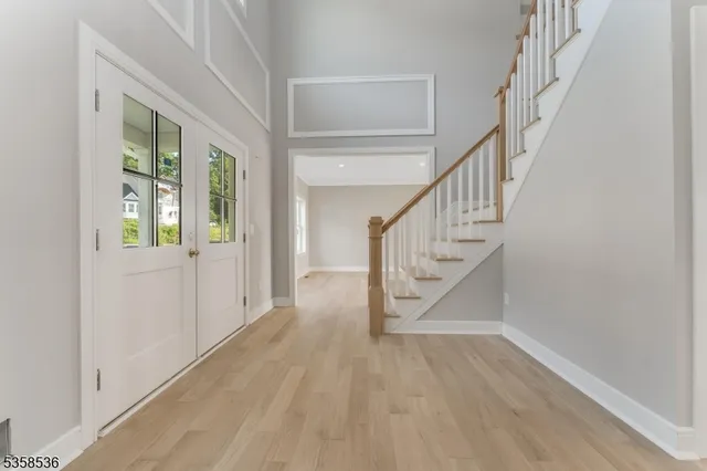 a view of entryway with wooden floor