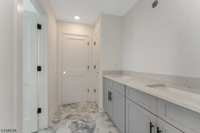 a room with a sink and cabinets