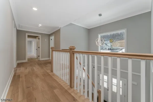 a spacious bathroom with a double vanity sink a mirror and a bathtub