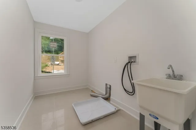 a bathroom with a sink and a window