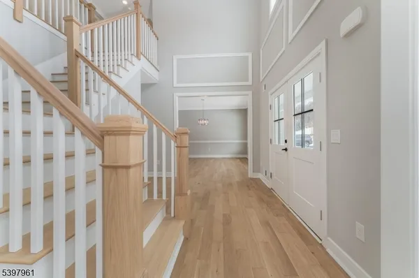 a view of an entryway with wooden floor