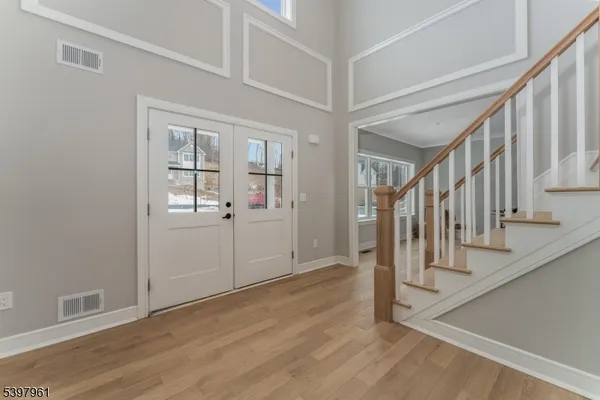 a view of livingroom with window hardwood floor and ceiling fan