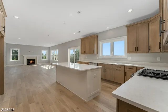 a kitchen with microwave a stove and cabinets