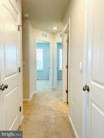 a view of a bathroom with a shower and a sink