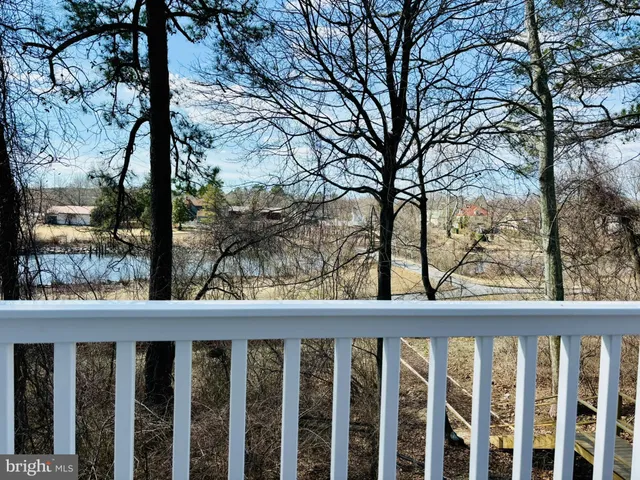 a view of a wooden fence from a window
