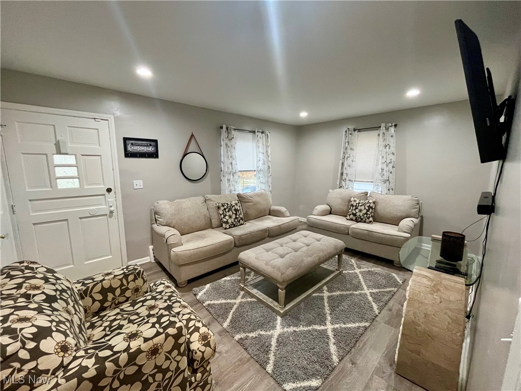 20907 Watson Road Maple Heights, OH 44137 - Photo 6 of 20 Living area with wood finished floors and recessed lighting
