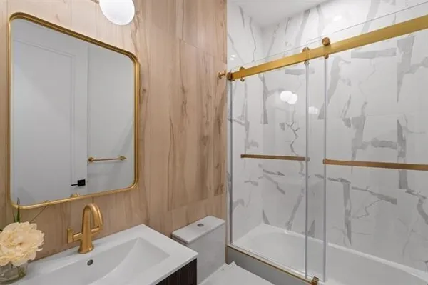 a bathroom with a shower and a sink