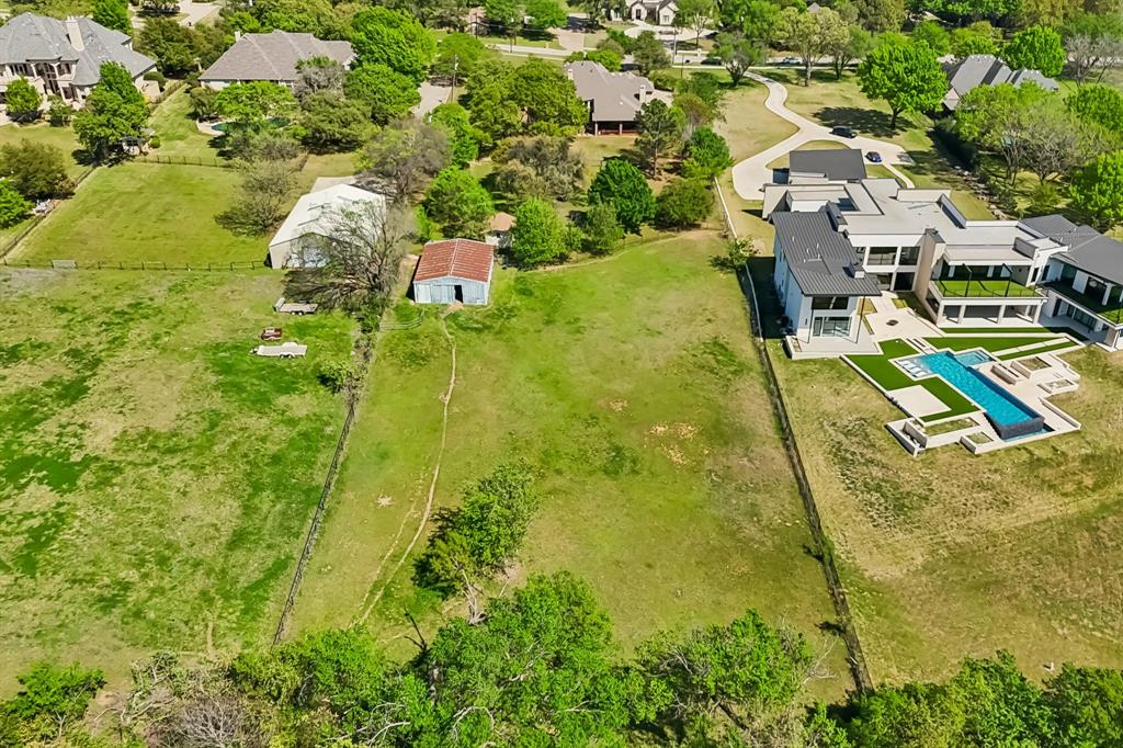 4604 Bill Simmons Road Colleyville, TX 76034 - Photo 5 of 22 a view of a swimming pool with a yard