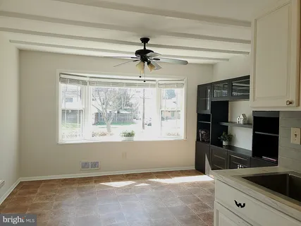 a view of a kitchen from a windows and a kitchen