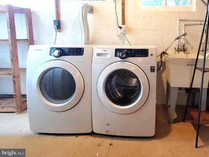 a utility room with dryer and washer