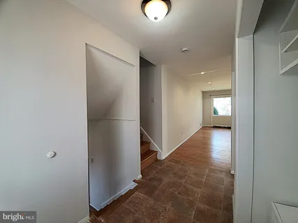 a view of entryway with kitchen