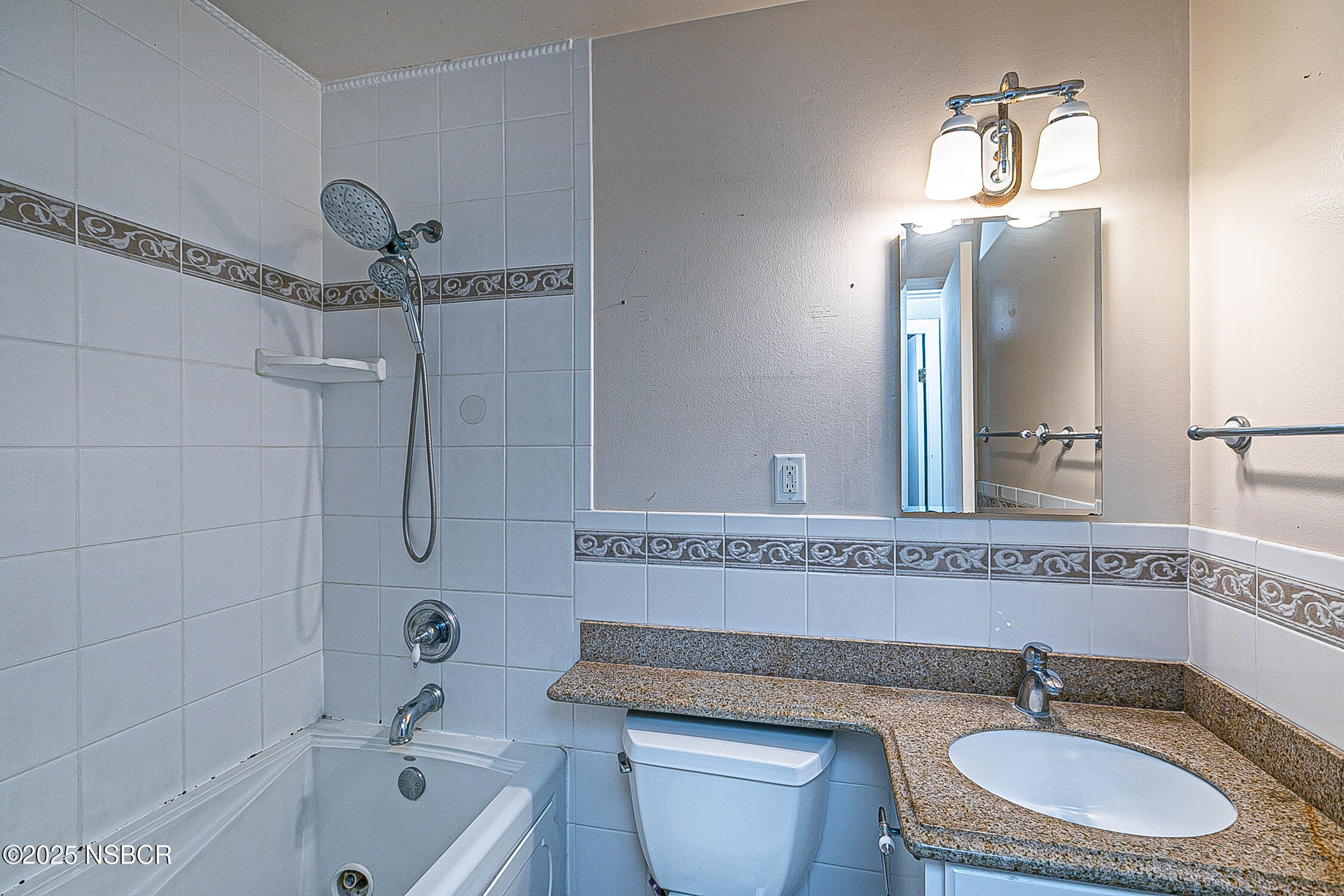 533 Sunbeam Road Lompoc, CA 93436 - Photo 18 of 27 a bathroom with a granite countertop sink mirror toilet and bathtub