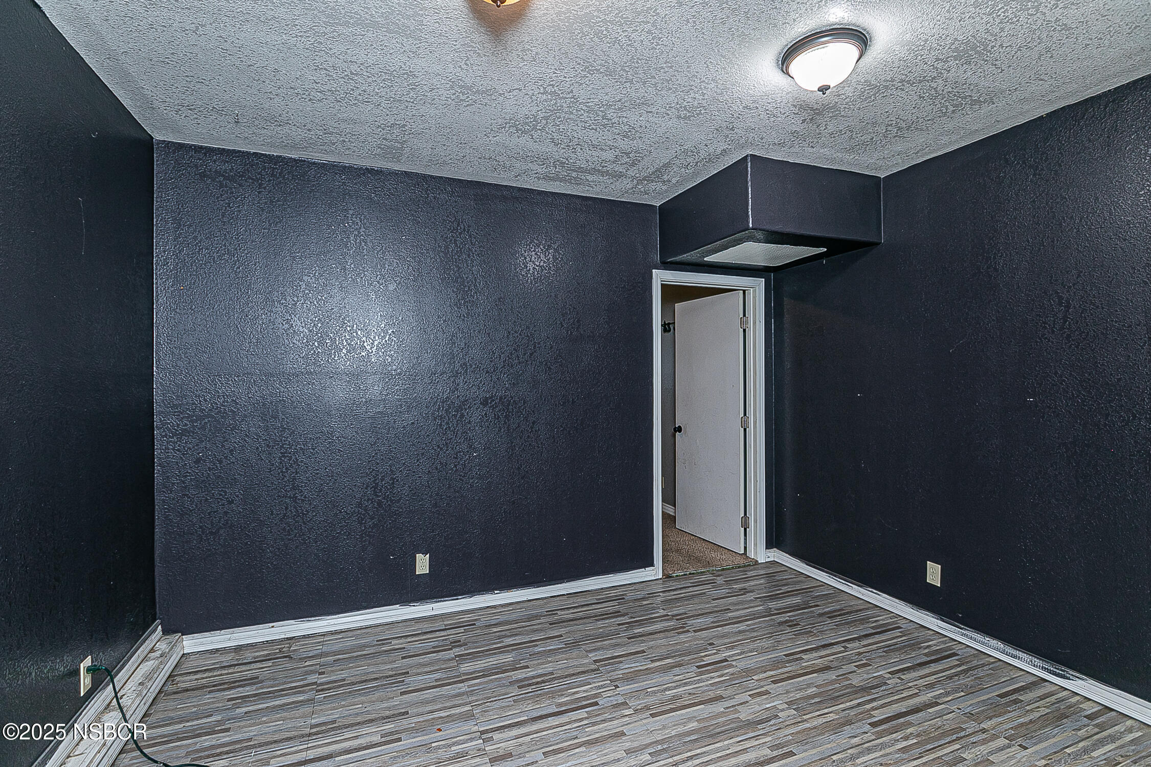 533 Sunbeam Road Lompoc, CA 93436 - Photo 19 of 27 a view of an empty room with wooden floor