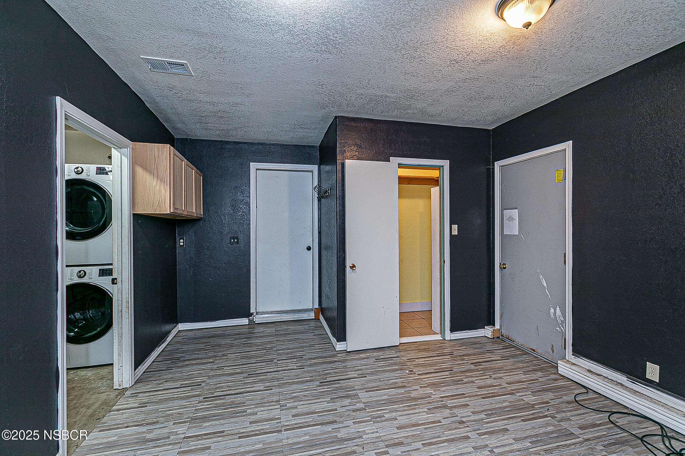 533 Sunbeam Road Lompoc, CA 93436 - Photo 20 of 27 a view of a hallway with wooden floor and a fireplace