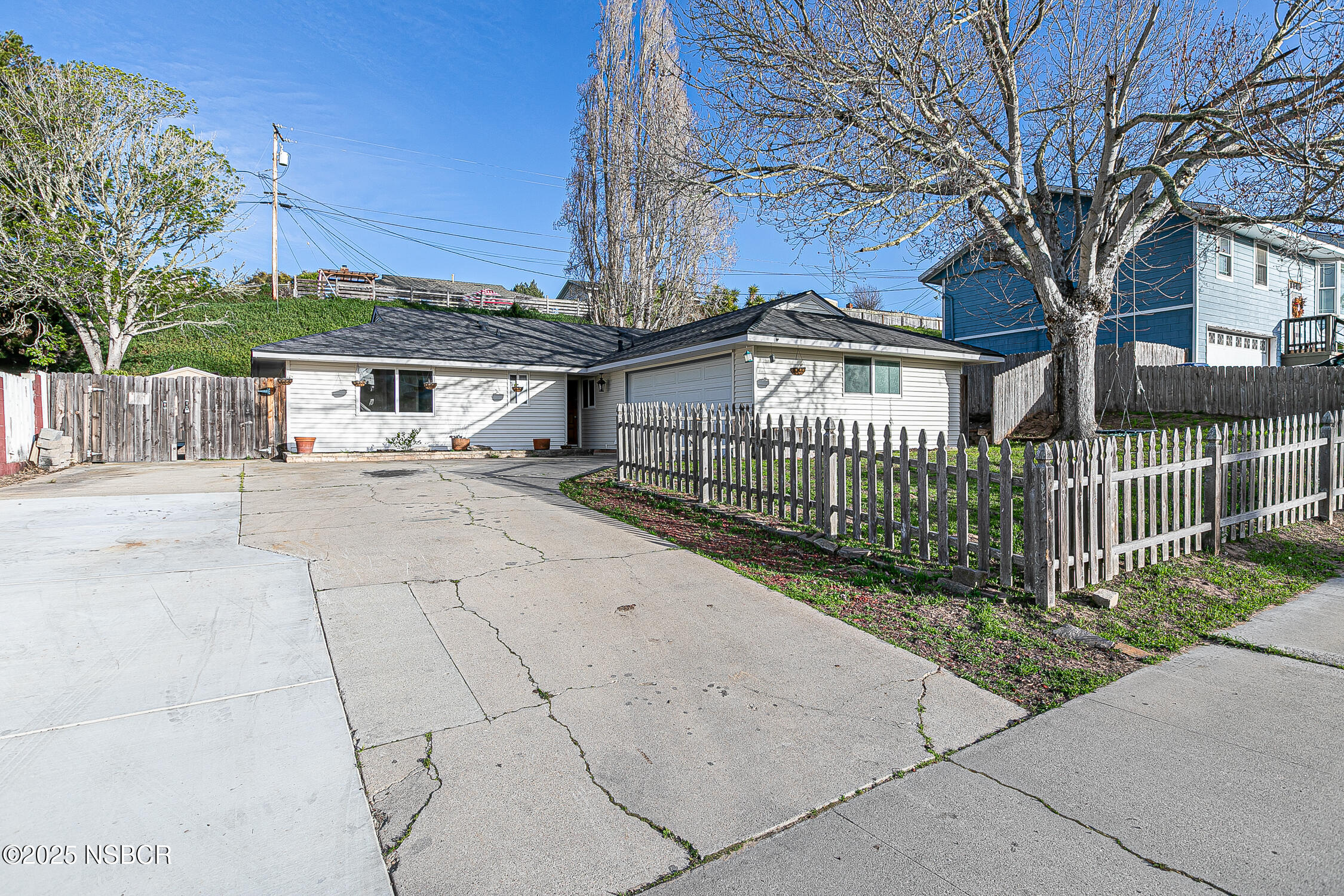 533 Sunbeam Road Lompoc, CA 93436 - Photo 25 of 27 a view of a house with a small yard and wooden fence
