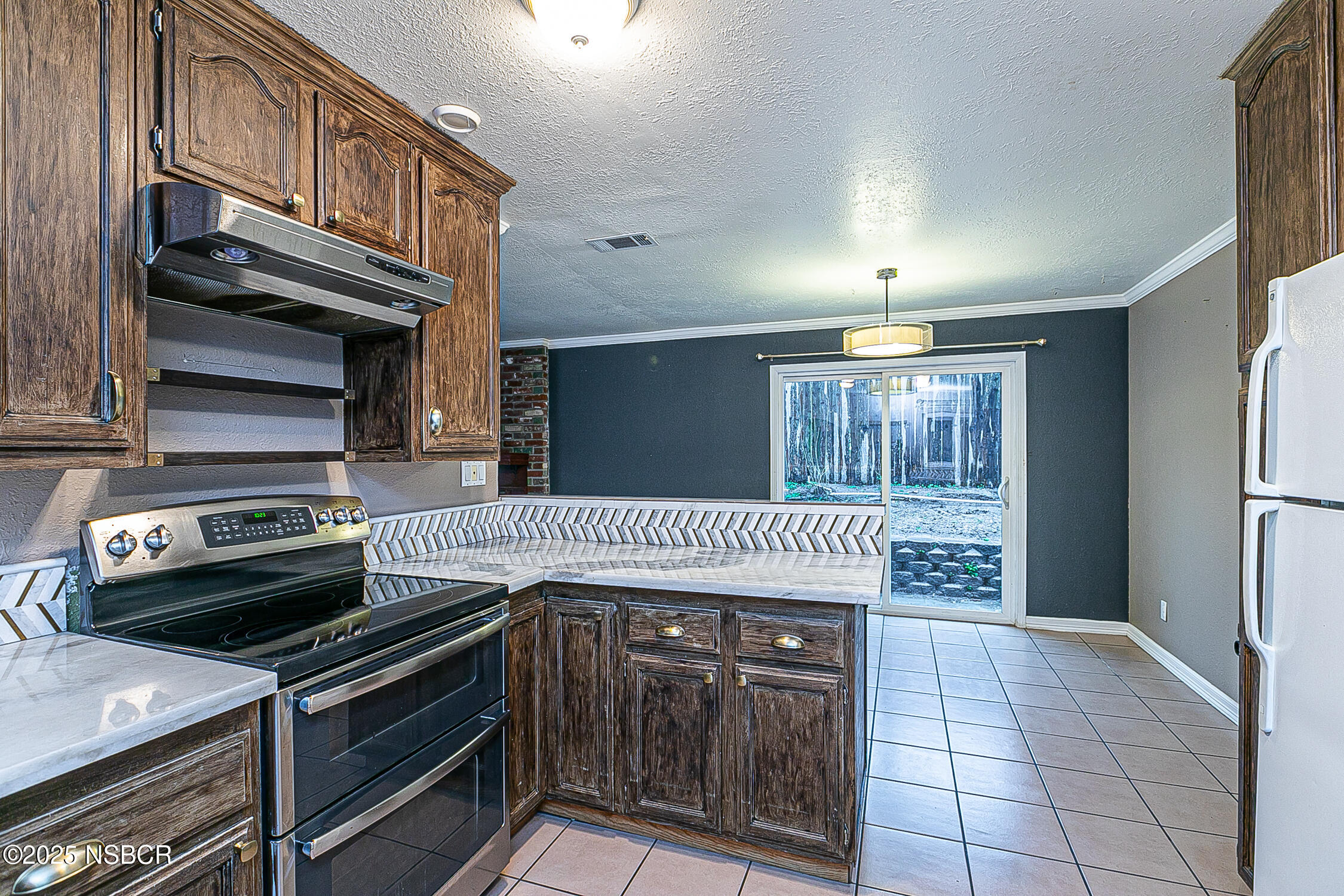 533 Sunbeam Road Lompoc, CA 93436 - Photo 10 of 27 a kitchen with a stove and a microwave