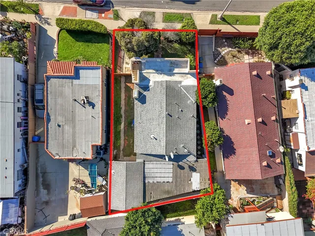 an aerial view of a house with a garden