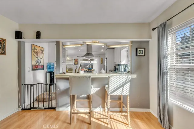 a view of a living room and chandelier