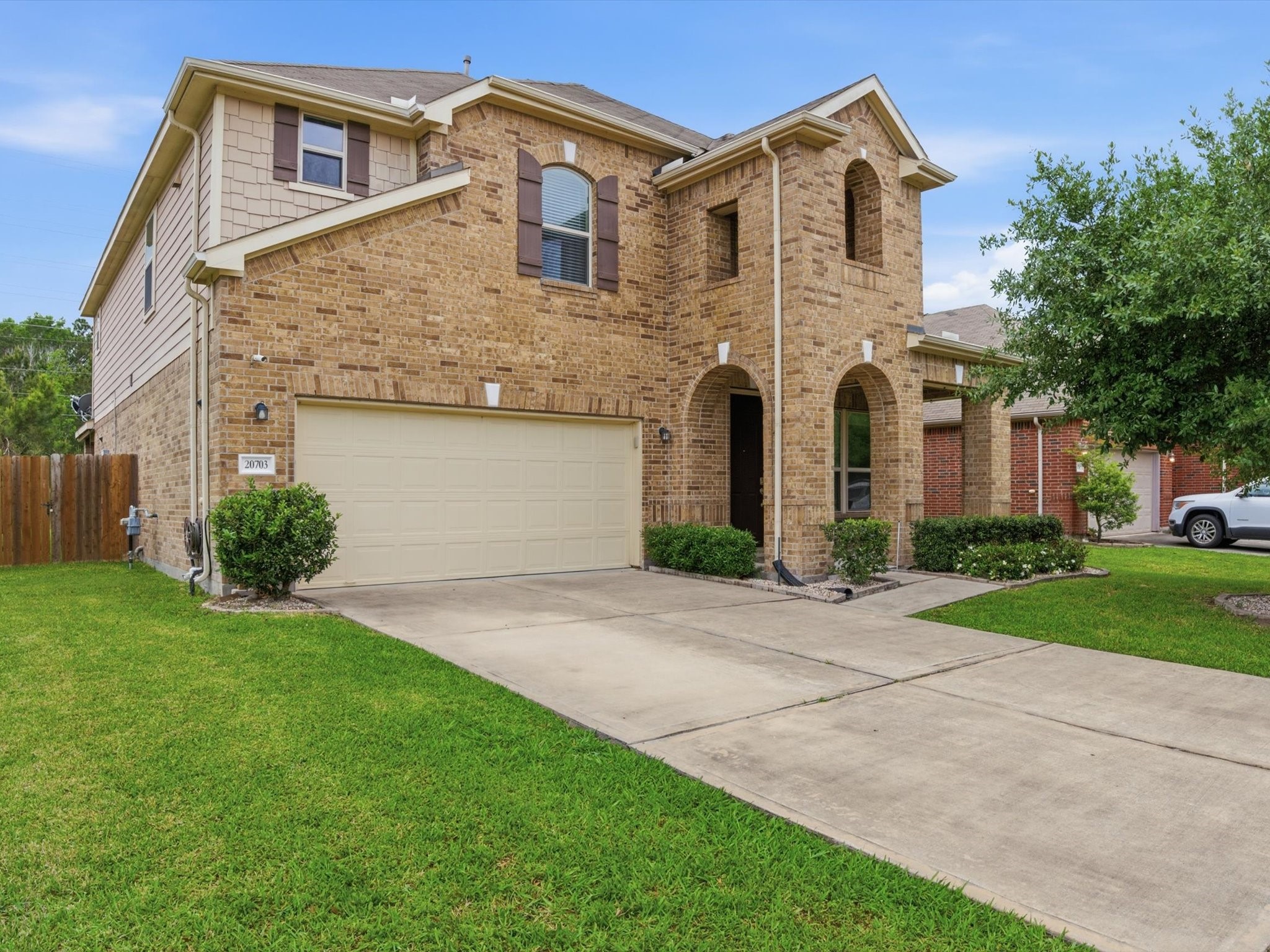 20703 Fawn Timber Trail Humble, TX 77346 - Photo 1 of 42 a front view of a house with a yard and garage