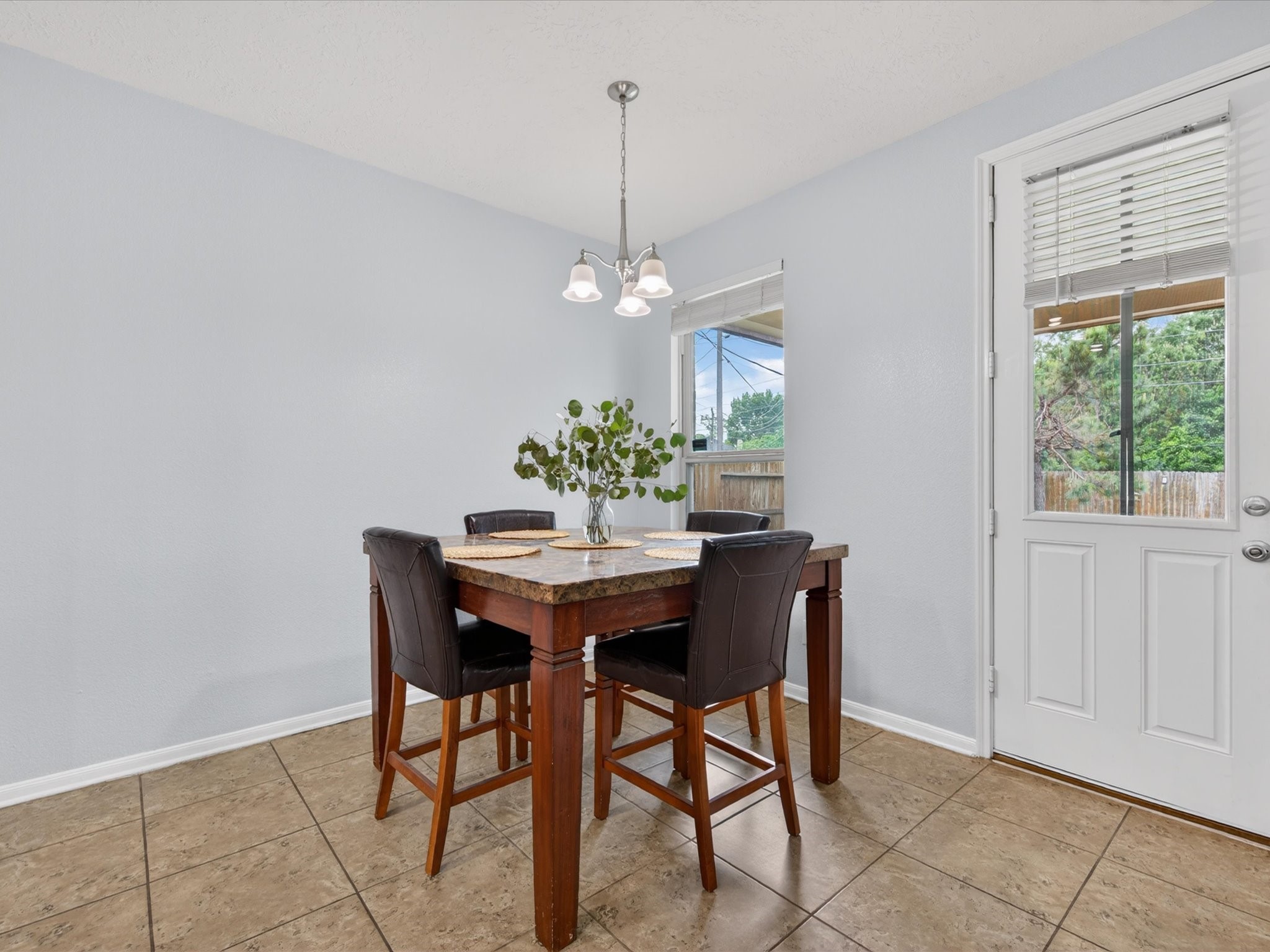 20703 Fawn Timber Trail Humble, TX 77346 - Photo 12 of 42 a view of a dining room with a table and chairs