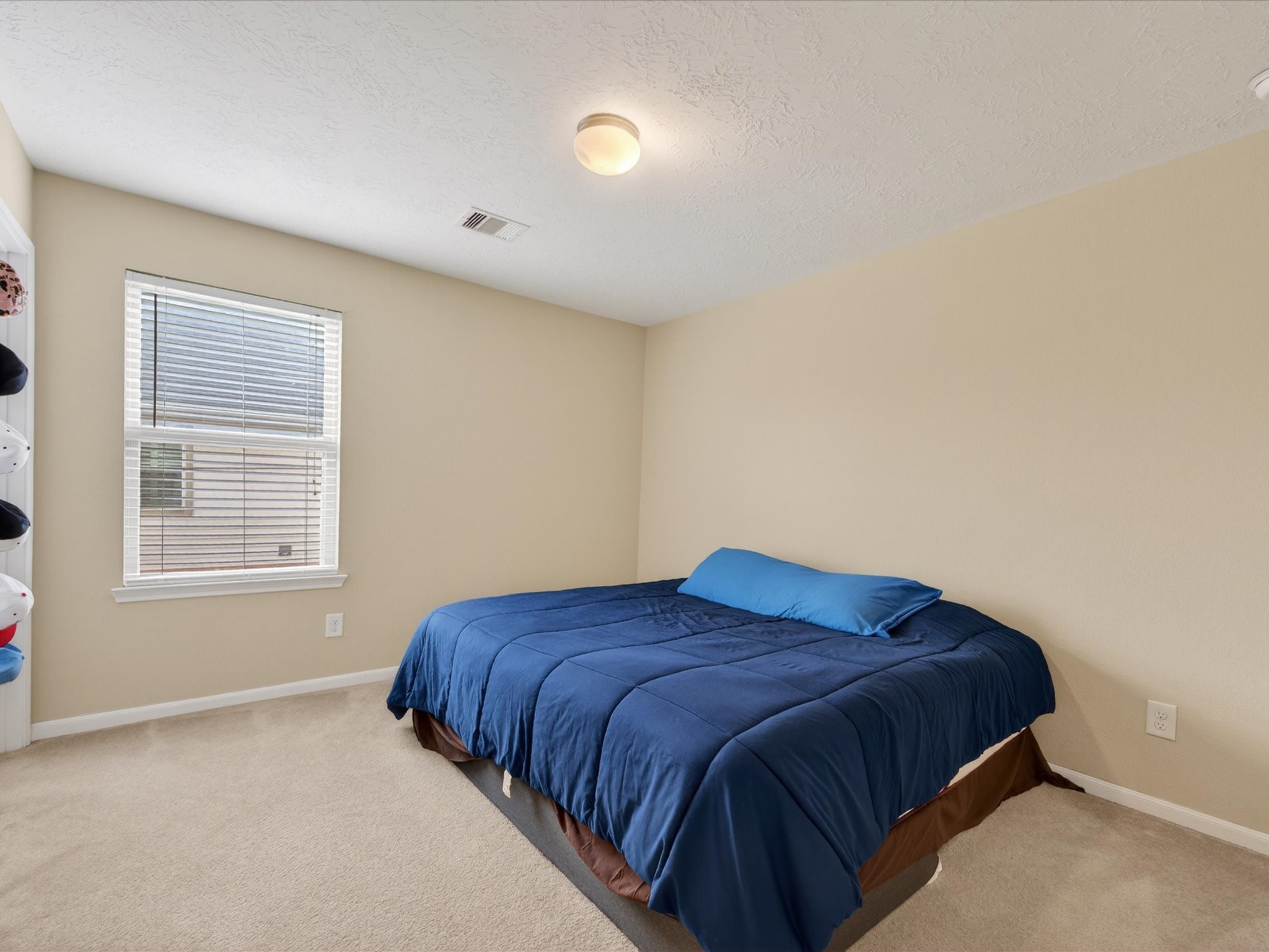 20703 Fawn Timber Trail Humble, TX 77346 - Photo 23 of 42 a bedroom with a bed and a window