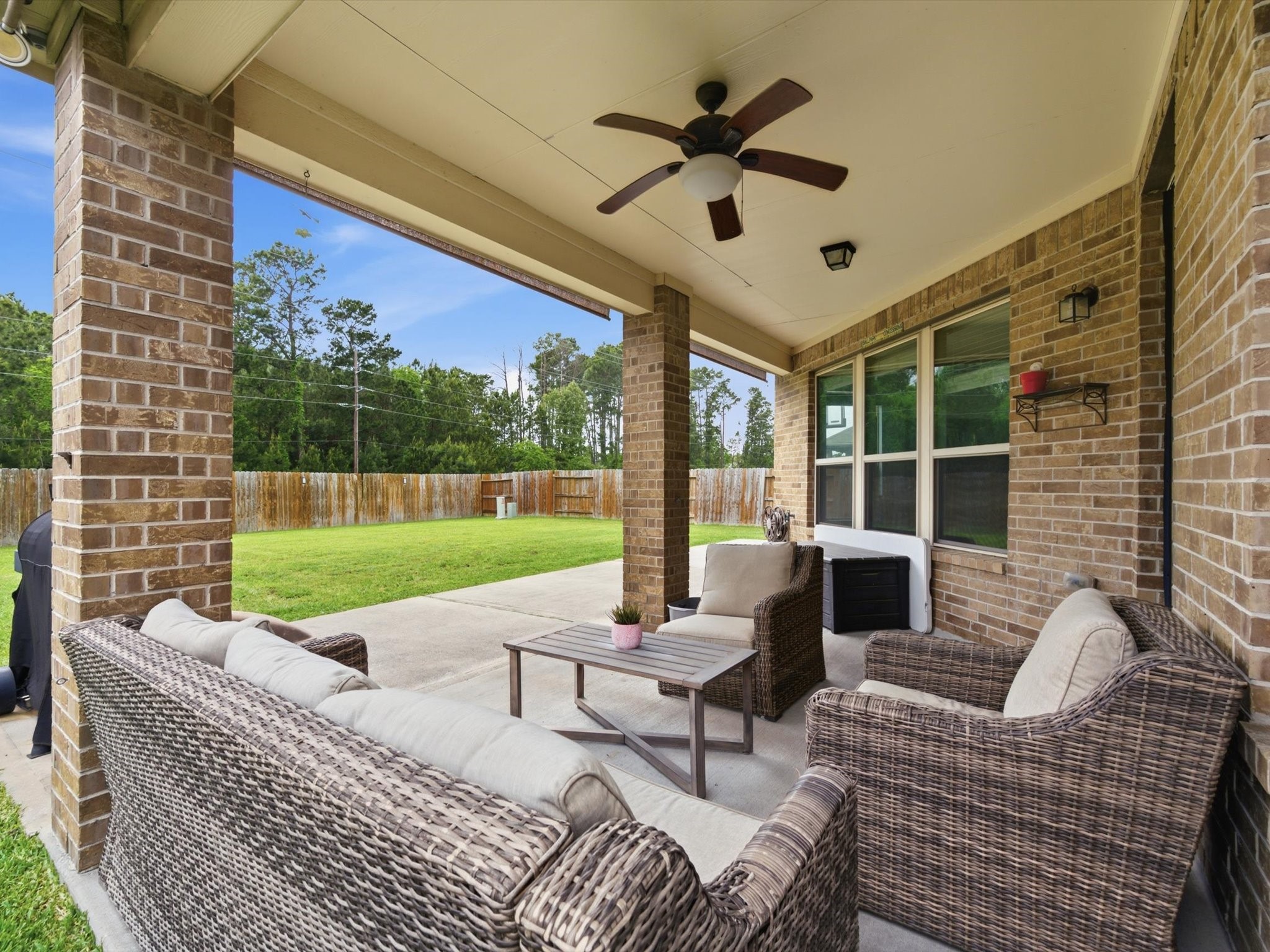 20703 Fawn Timber Trail Humble, TX 77346 - Photo 30 of 42 a view of a patio with a dining table and chairs