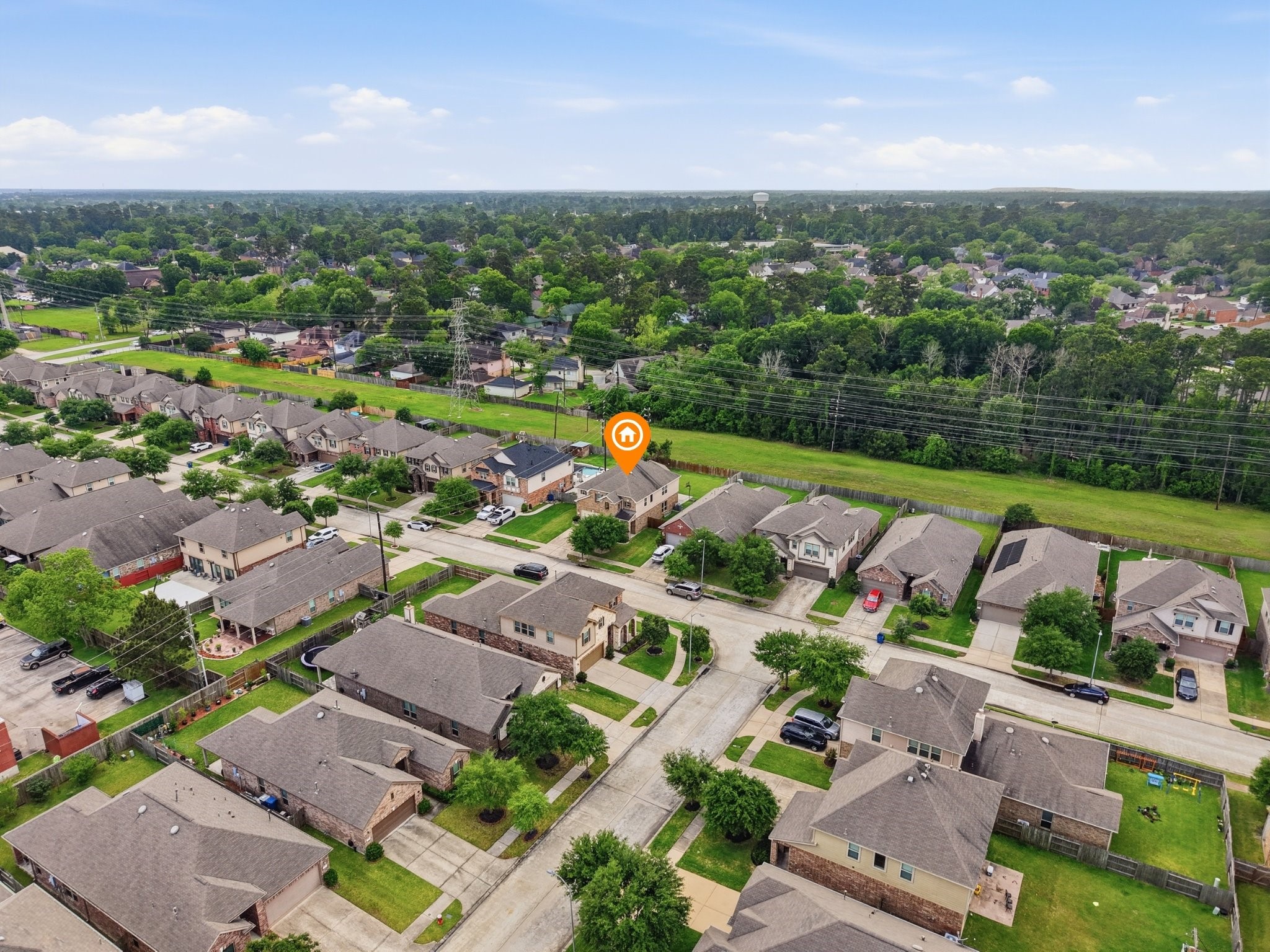 20703 Fawn Timber Trail Humble, TX 77346 - Photo 37 of 42 an aerial view of a city with lots of residential buildings ocean and mountain view in back