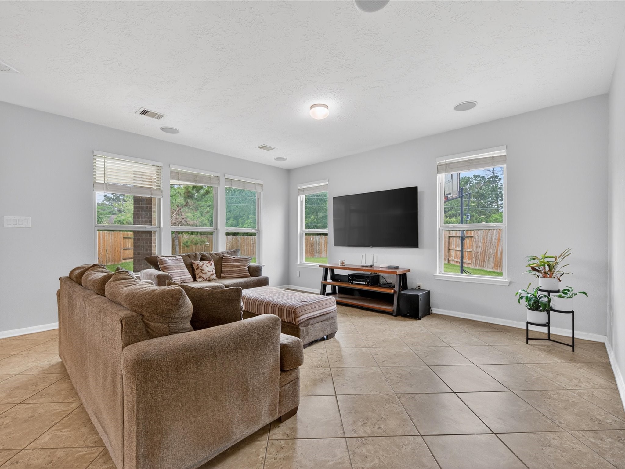20703 Fawn Timber Trail Humble, TX 77346 - Photo 5 of 42 a living room with furniture and a flat screen tv