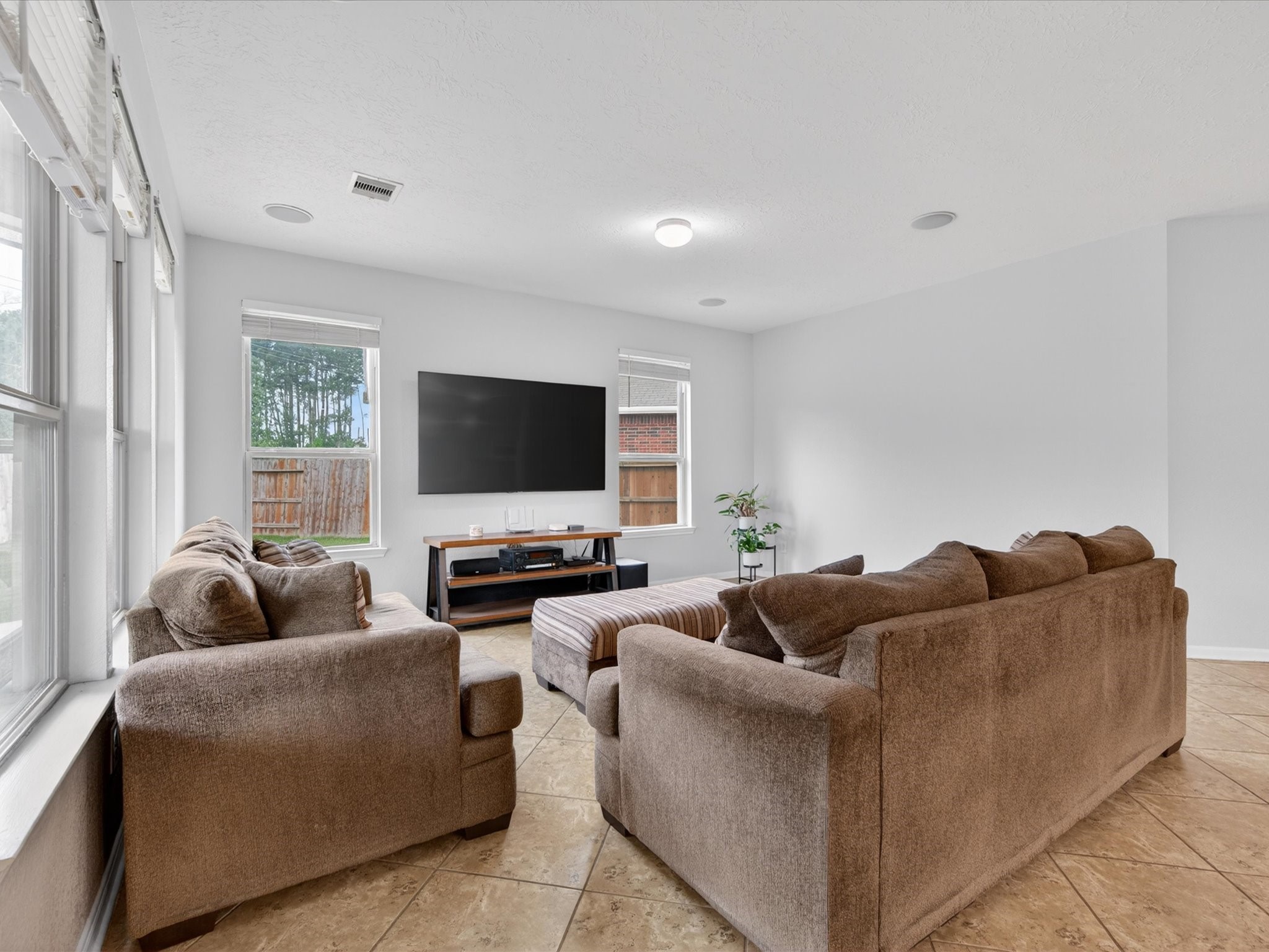 20703 Fawn Timber Trail Humble, TX 77346 - Photo 6 of 42 a living room with furniture and a flat screen tv