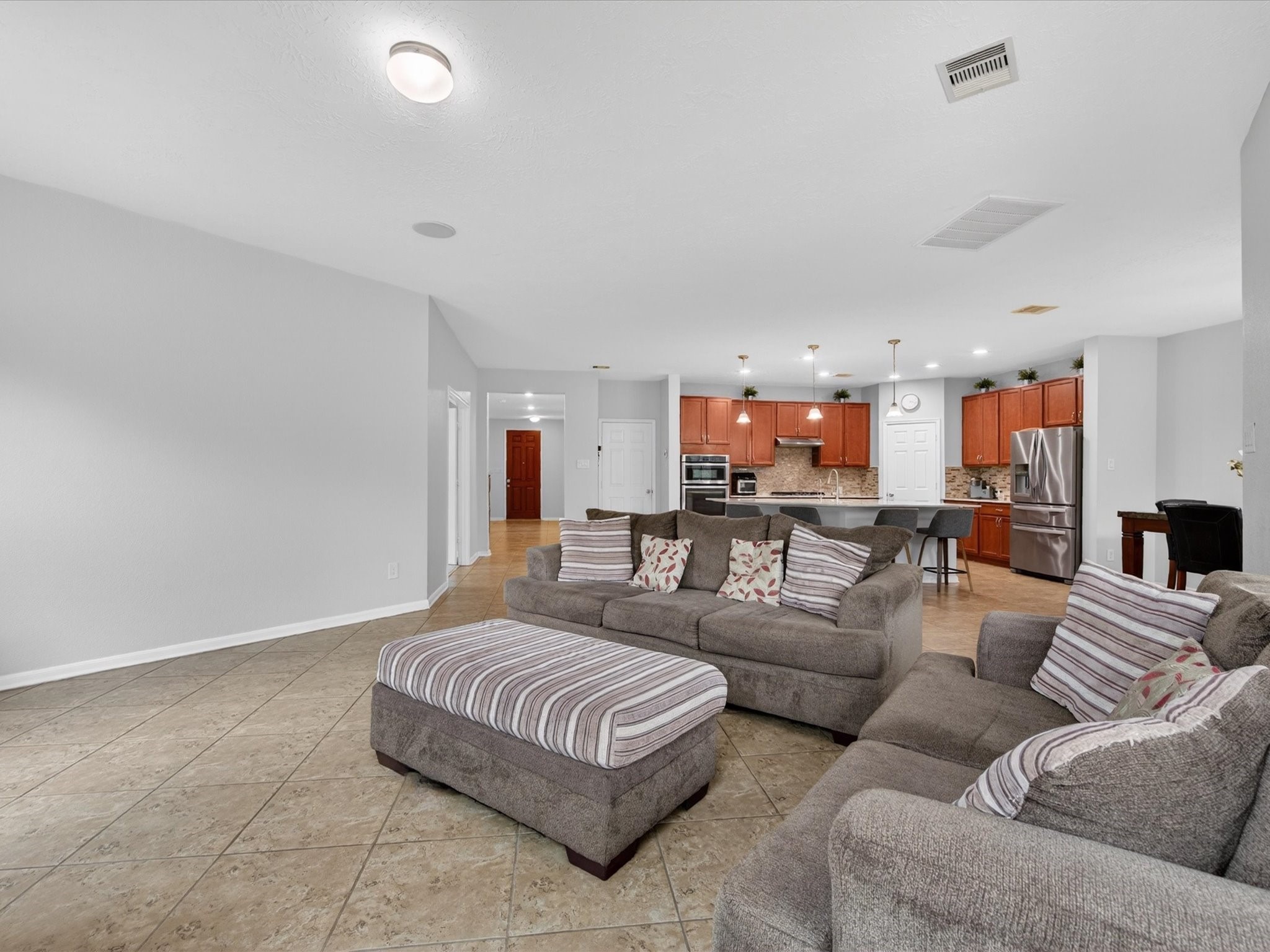 20703 Fawn Timber Trail Humble, TX 77346 - Photo 7 of 42 a living room with furniture and a view of kitchen