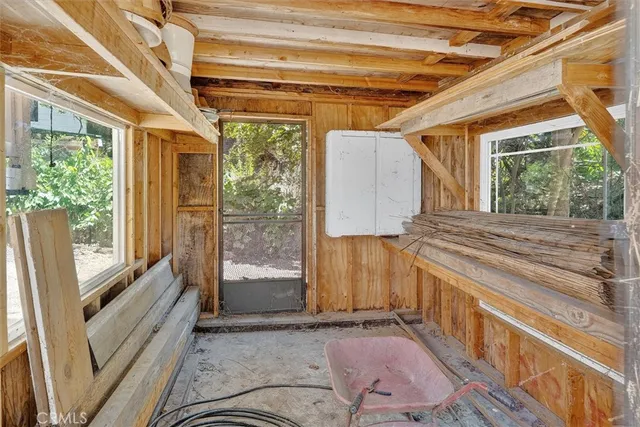 a view of entryway with wooden floor and windows