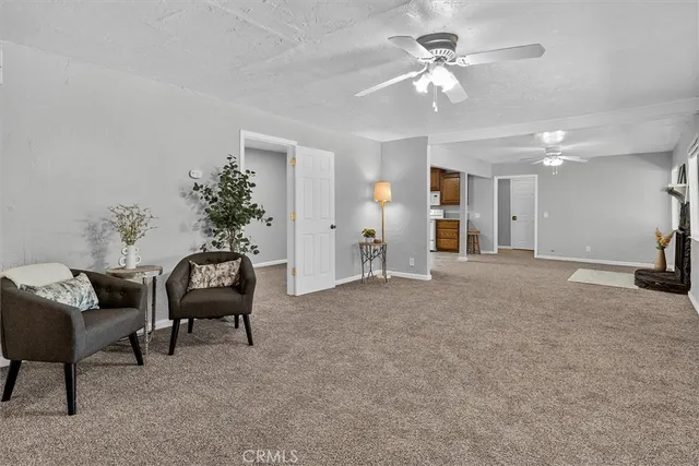 a view of a livingroom with furniture and a chandelier