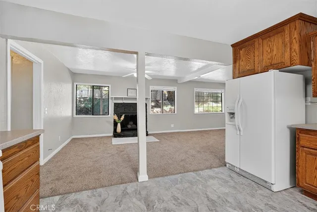 a view of livingroom with furniture and refrigerator