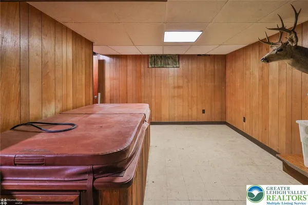 a bed sitting in a room next to a window