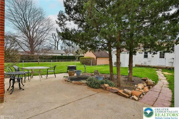 a view of a garden with patio