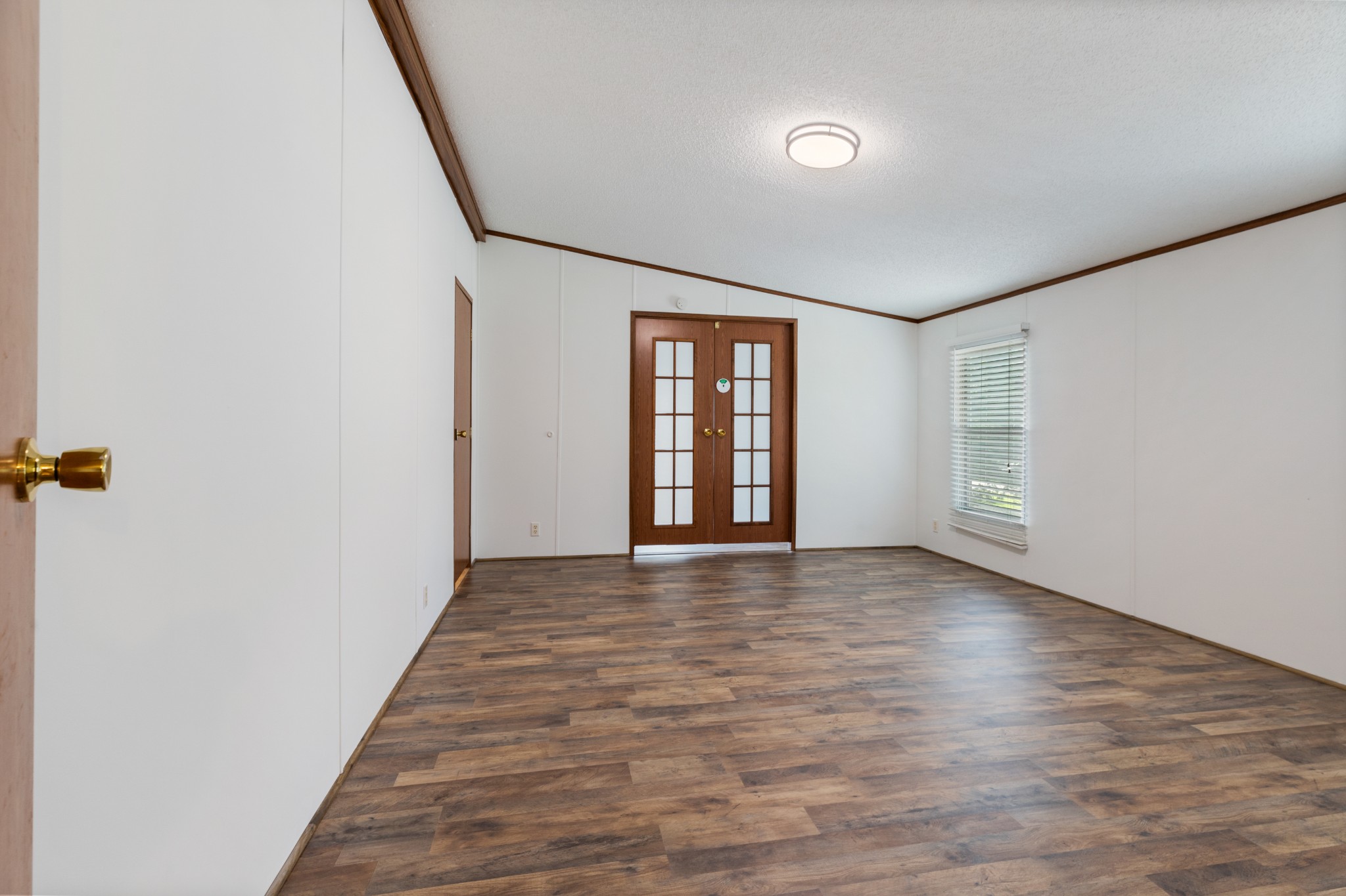 1033 Caps Ridge Dickson, TN 37055 - Photo 12 of 43 a view of an empty room with wooden floor and a window