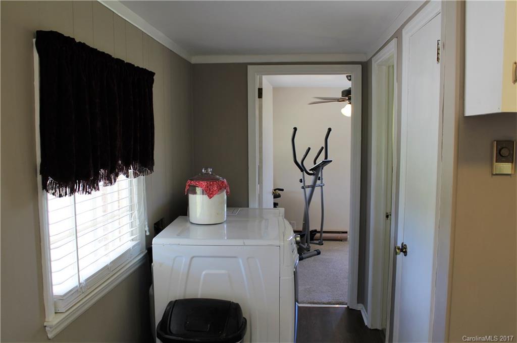 3304 Wolf Pond Road Monroe, NC 28112 - Photo 14 of 17 a bathroom with a sink toilet and shower