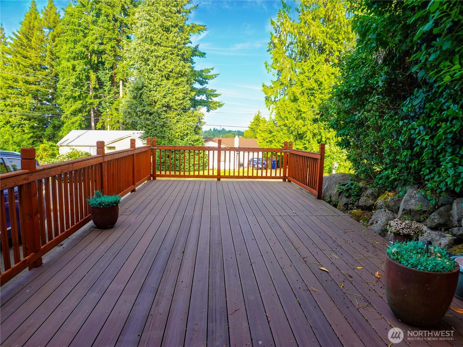 5451 32nd Avenue Southwest Seattle, WA 98126 - Photo 2 of 34 a view of deck with seating space and trees
