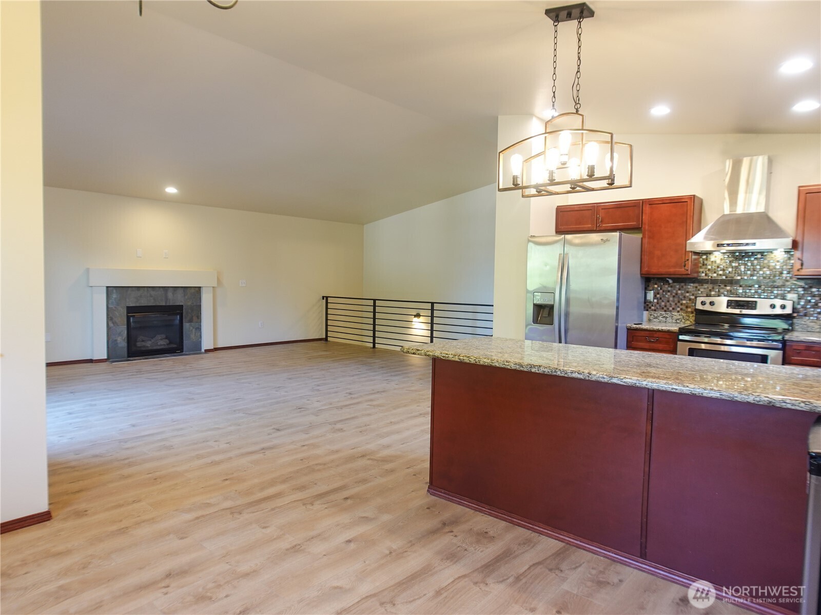 5451 32nd Avenue Southwest Seattle, WA 98126 - Photo 23 of 34 a view of a kitchen with a sink and wooden floor
