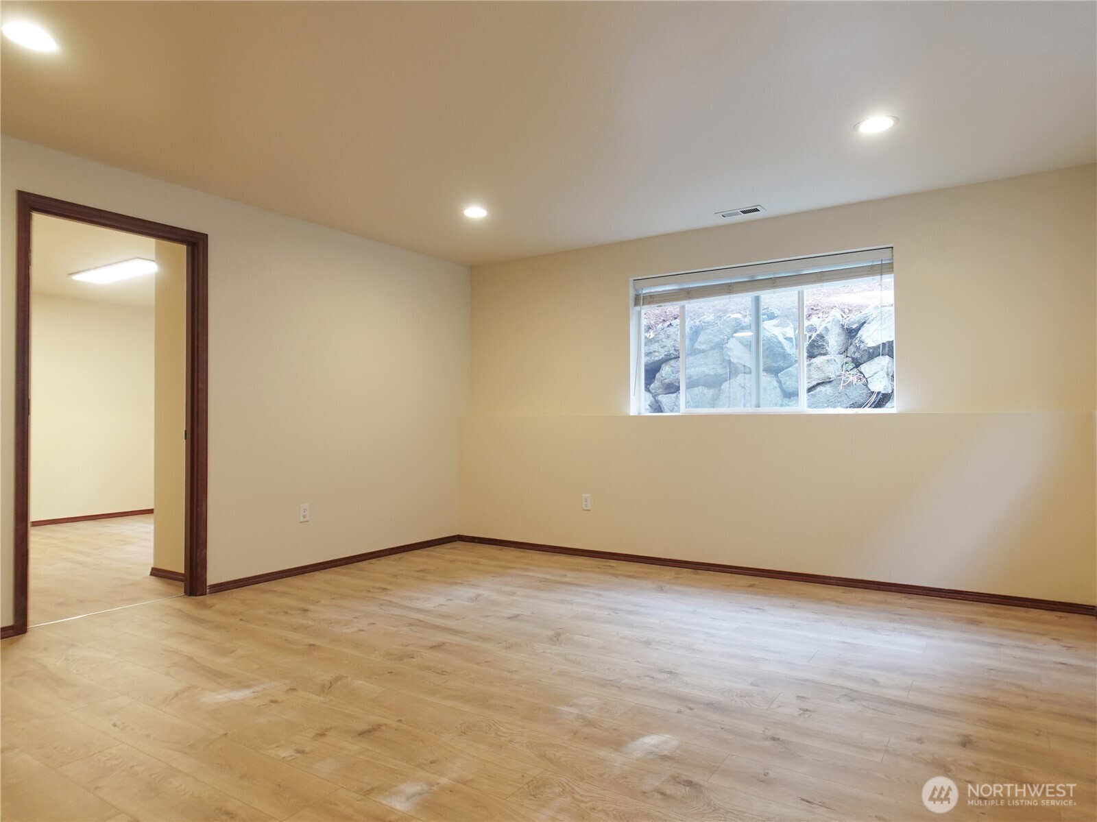 5451 32nd Avenue Southwest Seattle, WA 98126 - Photo 26 of 34 an empty room with wooden floor and windows