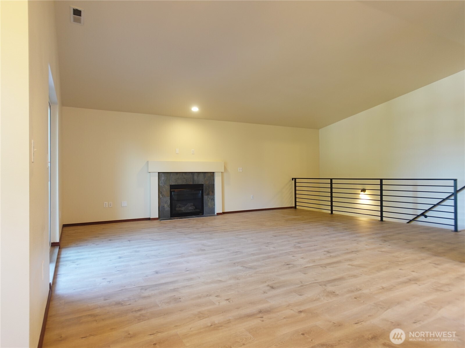 5451 32nd Avenue Southwest Seattle, WA 98126 - Photo 29 of 34 a view of empty room with wooden floor