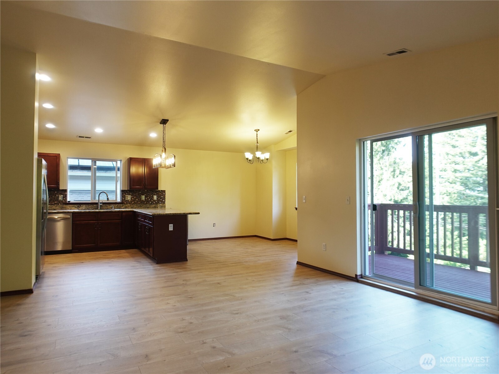 5451 32nd Avenue Southwest Seattle, WA 98126 - Photo 30 of 34 a large kitchen with a large window and stainless steel appliances
