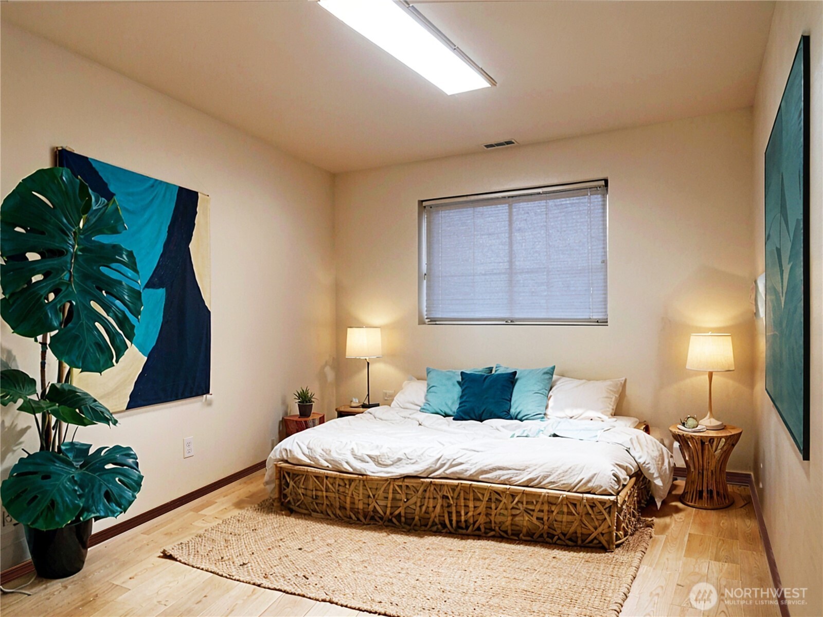 5451 32nd Avenue Southwest Seattle, WA 98126 - Photo 8 of 34 a bedroom with a bed and a potted plant