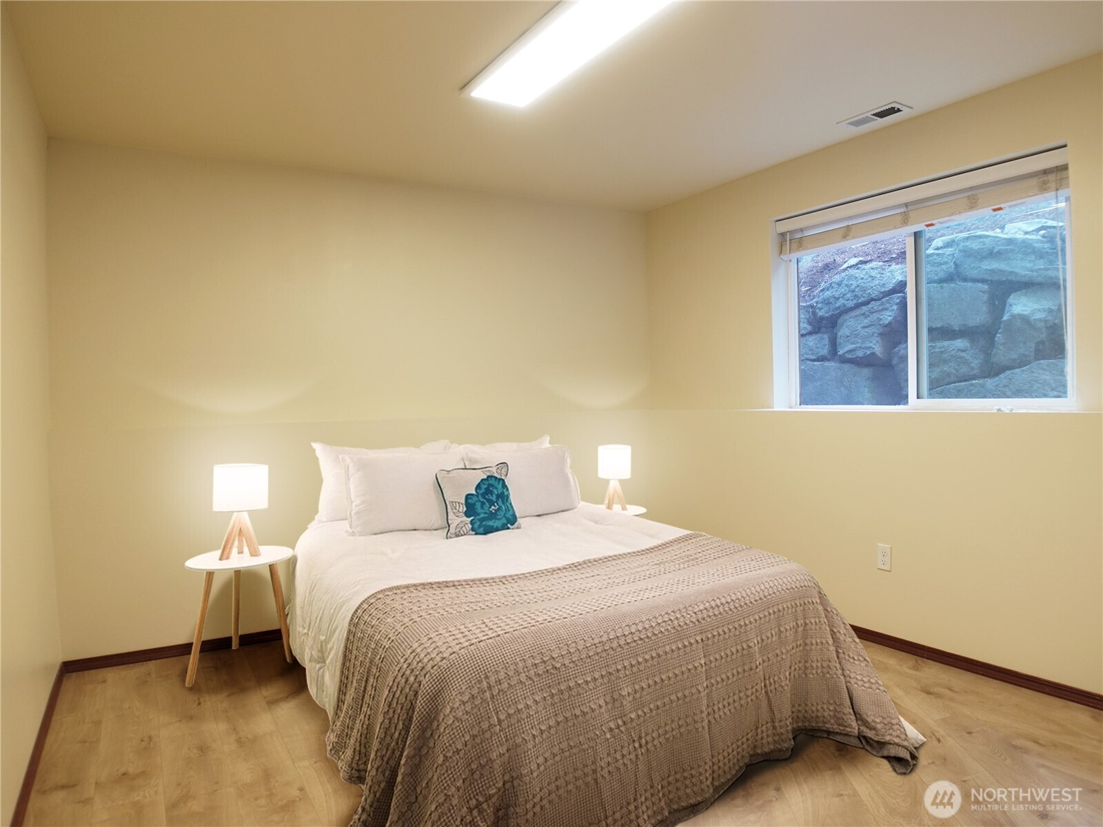 5451 32nd Avenue Southwest Seattle, WA 98126 - Photo 9 of 34 a bedroom with a bed and a window