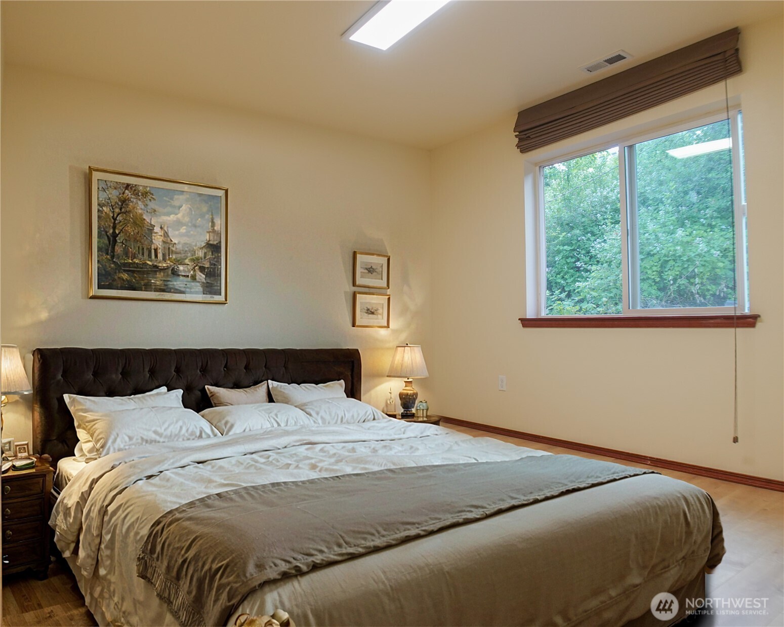 5451 32nd Avenue Southwest Seattle, WA 98126 - Photo 10 of 34 a bedroom with a bed and a window