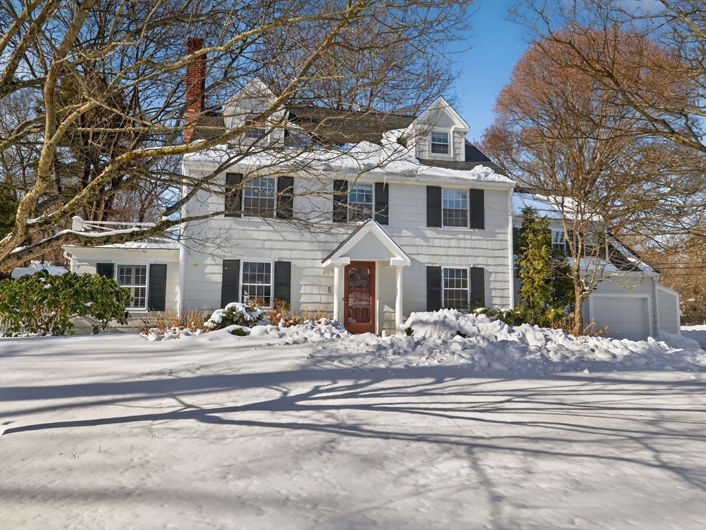 a front view of a house with a white walls