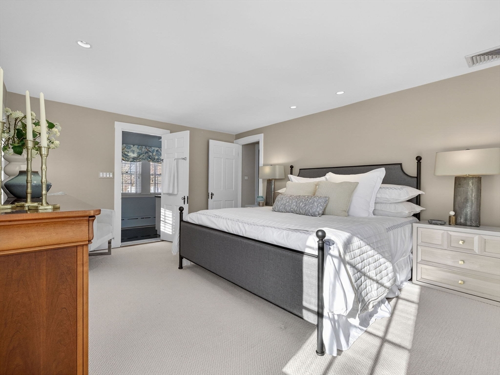 5 Tennyson Road Wellesley, MA 02481 - Photo 18 of 28 a bedroom with a large bed and a dresser in it