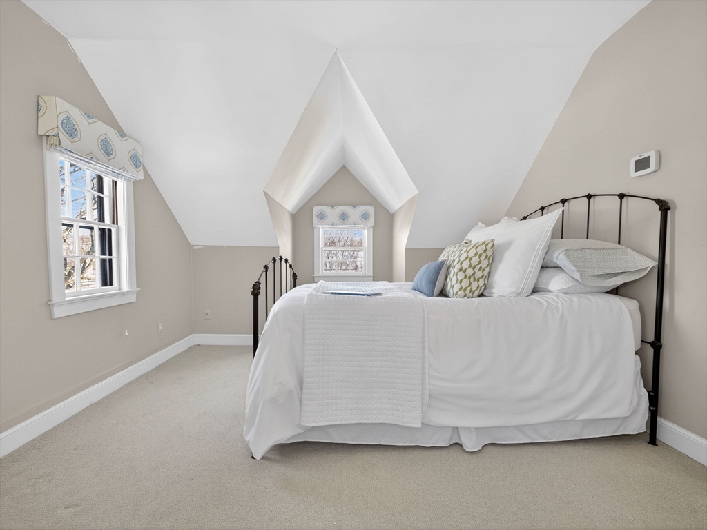 5 Tennyson Road Wellesley, MA 02481 - Photo 20 of 28 a spacious bedroom with a bed and a window