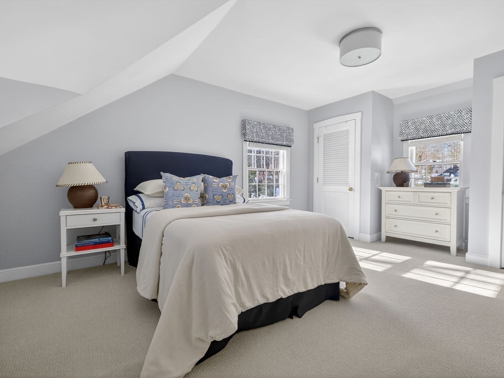 5 Tennyson Road Wellesley, MA 02481 - Photo 21 of 28 a bedroom with a bed and a cabinets