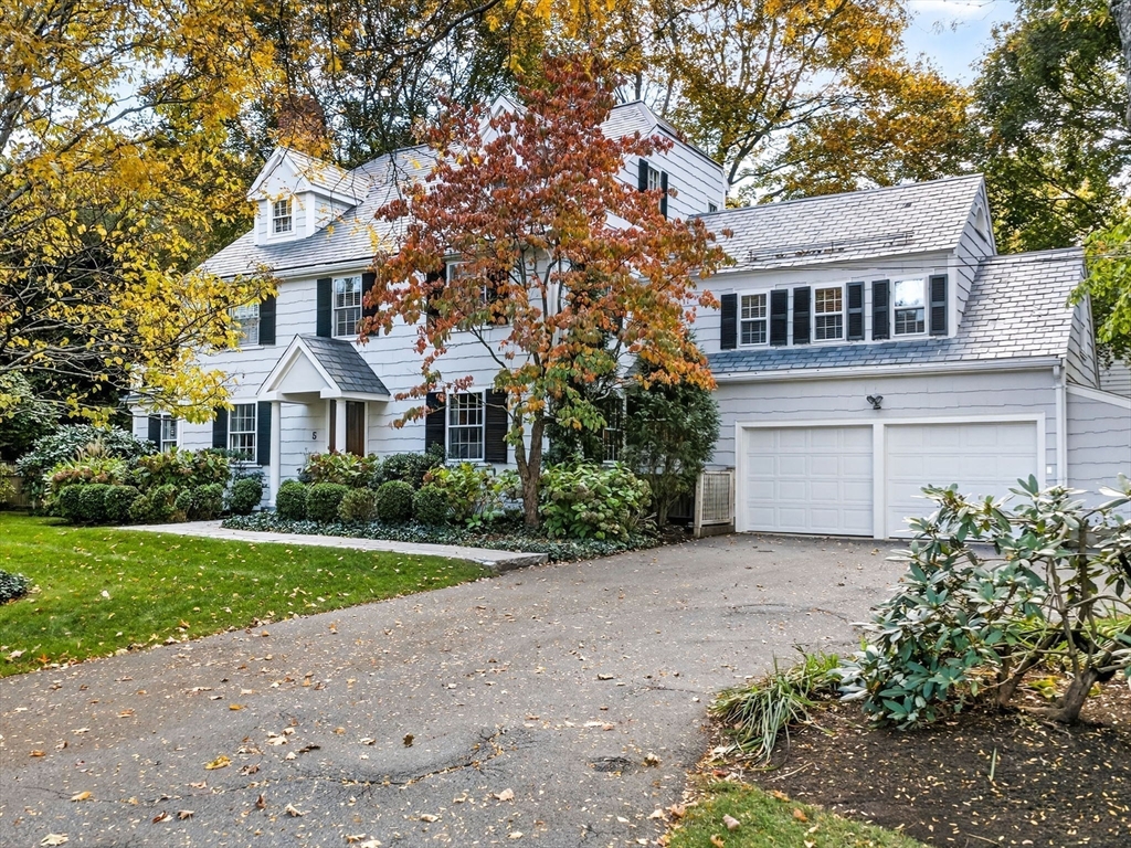 5 Tennyson Road Wellesley, MA 02481 - Photo 24 of 28 a front view of a house with a yard and garage